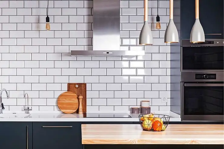 minimalist kitchen grey backsplash and black cabinets