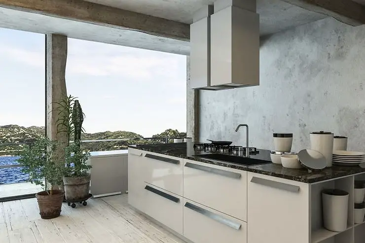 kitchen white cabinets and concrete wall with sea view