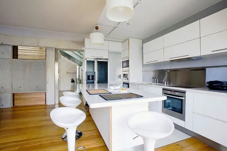 minimalist kitchen wood floor and concrete walls